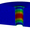 Simulation numérique d’un trou traversant, présent dans un circuit imprimé. Les couleurs représentent les déformations au sein du cuivre, lors d’une élévation de température. La zone bleue correspond au substrat (composite résine + fibres de verre) de la carte du circuit imprimé